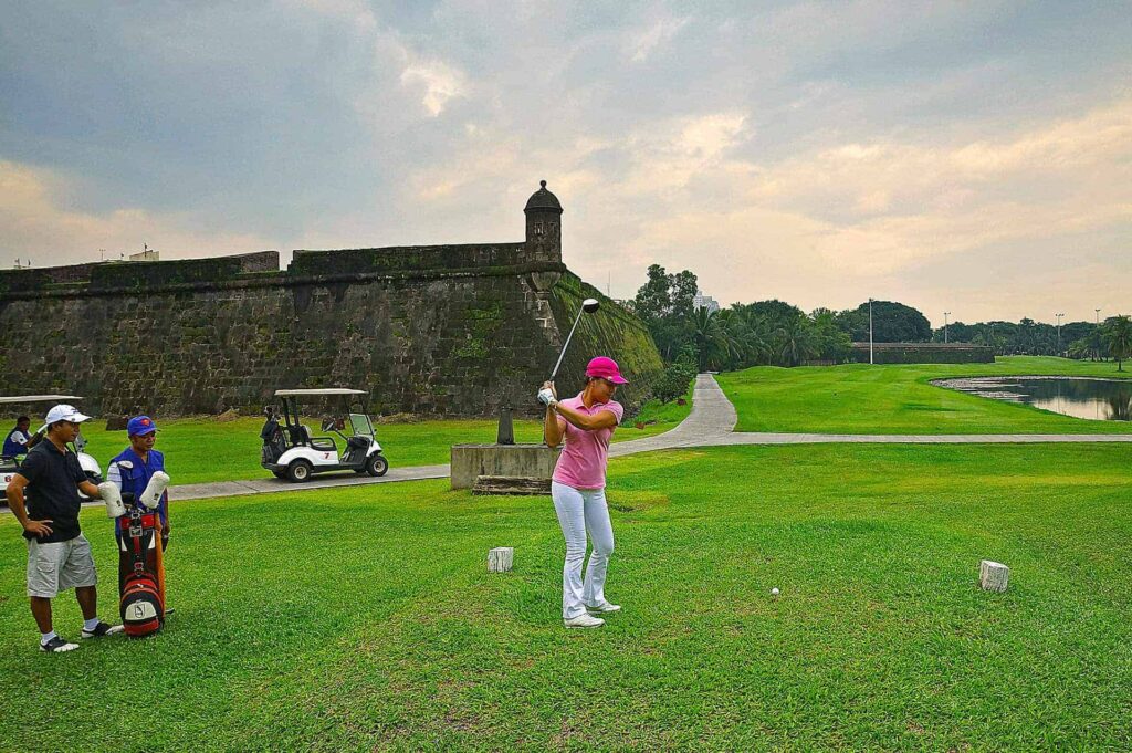 Go golfing at the Club Intramuros Golf Course.