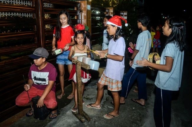 Be ready to open your door to little Christmas carolers