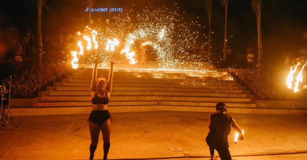 Watch the fire dancers at White Beach